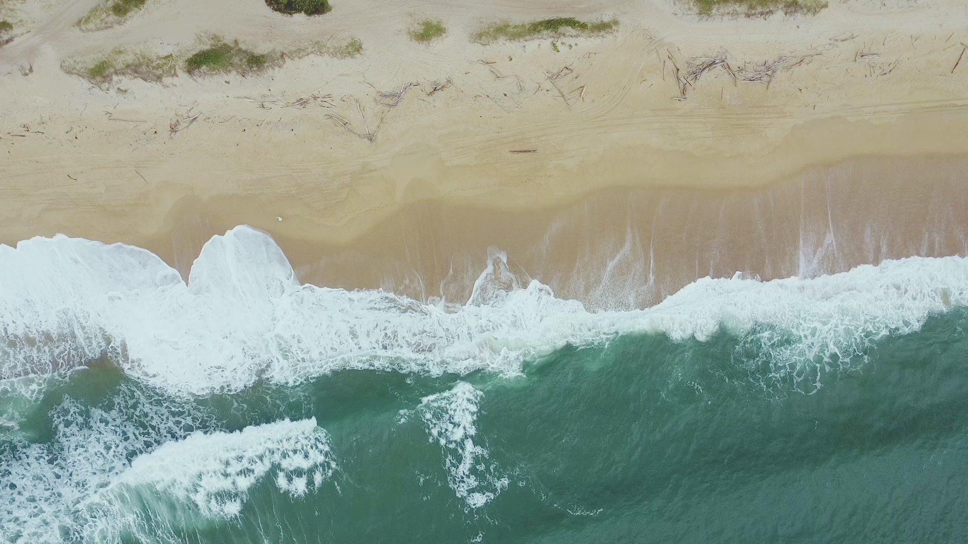 Load video: Tides crashing on the beach shoreline